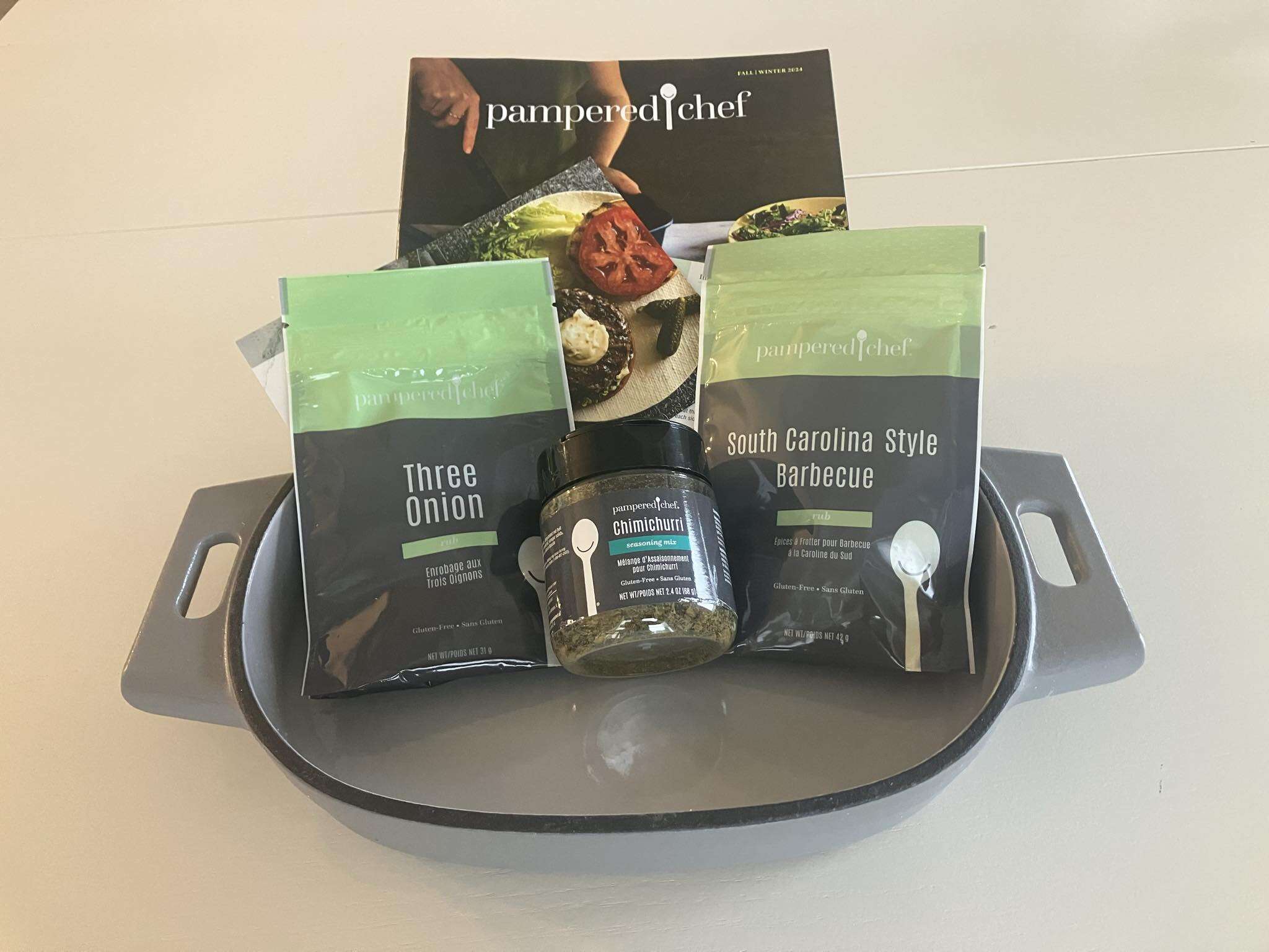 Pampered Chef Gift Package - Includes a 2L Sized Enameled Cast Iron Baker (Goes from stovetop to oven to table), Chimichurri Seasoning, & Packages of Onion Rub and BBQ Rub; includes recipes
