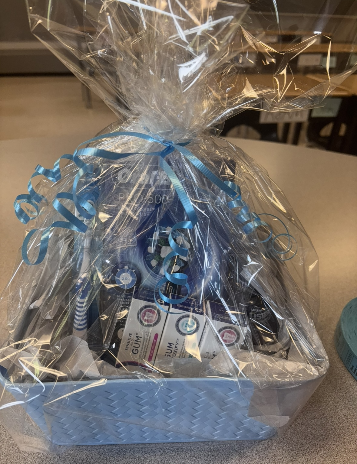 Water Street Dentistry Gift Basket - Includes an Oral B Pro 500+ Rechargeable Toothbrush, 3 toothbrushes, 3 Crest Health Toothpastes (20ml) and 2 Listerine Total Care (96ml)